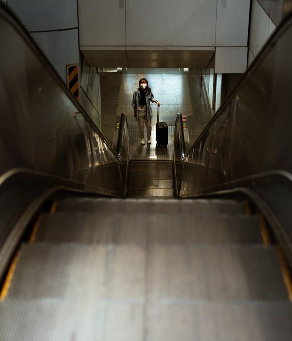 Person walking up stairs instead of using an elevator.